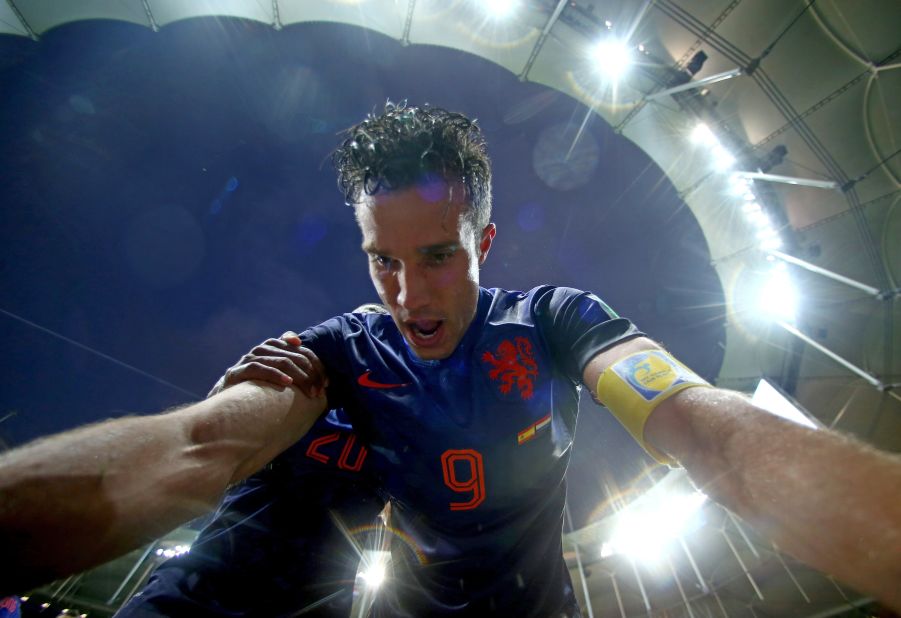 Dutch forward Robin van Persie celebrates after scoring against Spain. He also had two goals in the match.