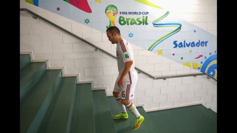 Spanish midfielder Andres Iniesta walks to the dressing room after the game against the Netherlands in Salvador, Brazil. 