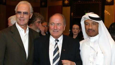 Franz Beckenbauer (L) with FIFA president Sepp Blatter (C) and Mohammed bin Hammam, at a 2003 FIFA Congress in Qatar. 