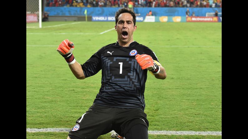 Goalkeeper Claudio Bravo of Chile celebrates after his team scored at the end of the match against Australia on Friday, June 13. Chile won 3-1. Friday was the second day of the soccer tournament, which is being held in 12 cities across Brazil. <a href="index.php?page=&url=http%3A%2F%2Fwww.cnn.com%2F2014%2F06%2F12%2Ffootball%2Fgallery%2Fworld-cup-0612%2Findex.html" target="_blank">See Thursday's best photos</a>