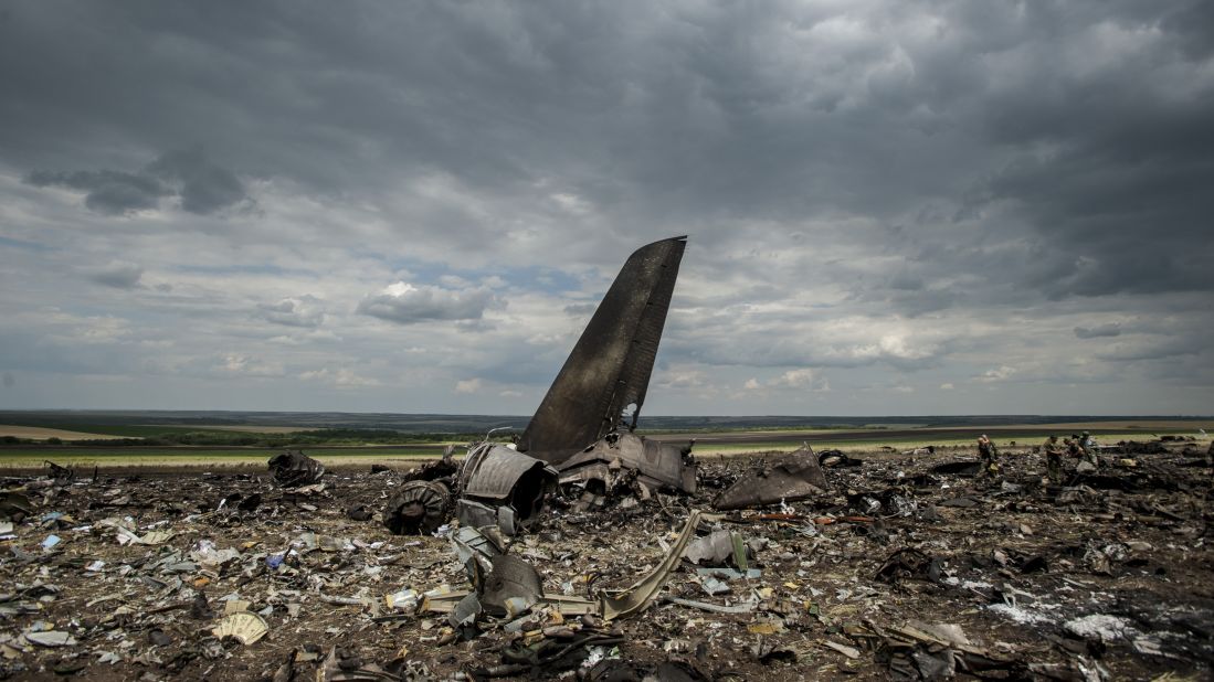 Debris lies scattered at an airport in Luhansk, Ukraine, on Saturday, June 14, after the crash of a Ukrainian Ilyushin-76 military transport plane. A military spokesman said the aircraft was shot down by pro-Russian separatists, killing all 49 aboard. 