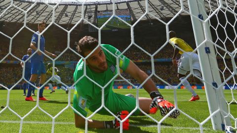 Greece goalkeeper Orestis Karnezis fails to keep out a deflected shot by Colombia's Pablo Armero in the fifth minute of the match.  