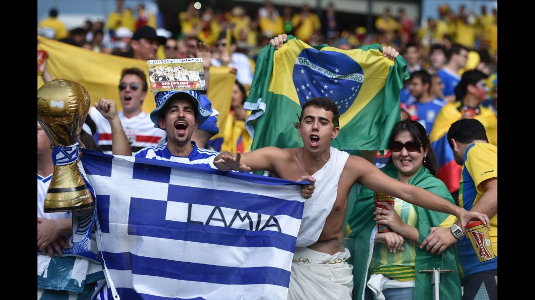 Greece fans hold up banners prior to the start of the game. 
