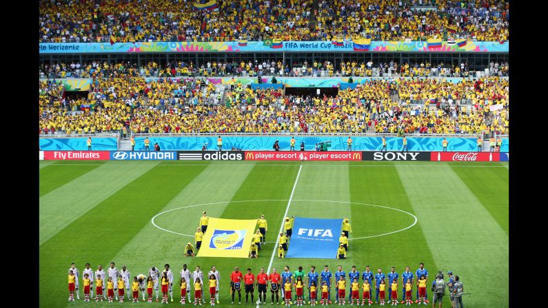 The Colombia and Greece teams line up ahead of the opening Group C match. <a href="index.php?page=&url=http%3A%2F%2Fwww.cnn.com%2F2014%2F06%2F13%2Ffootball%2Fgallery%2Fworld-cup-0613%2Findex.html">See the best World Cup photos from June 13.</a>