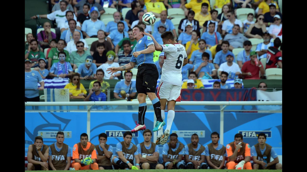 Costa Rica defender Oscar Duarte, right, and Uruguay midfielder Cristian Rodriguez vie for the ball. 