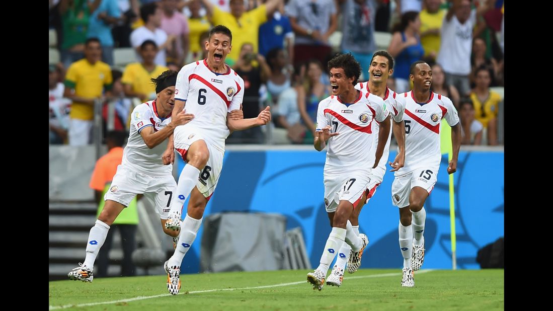 Oscar Duarte of Costa Rica, second left, celebrates scoring his team's second goal against Uruguay.