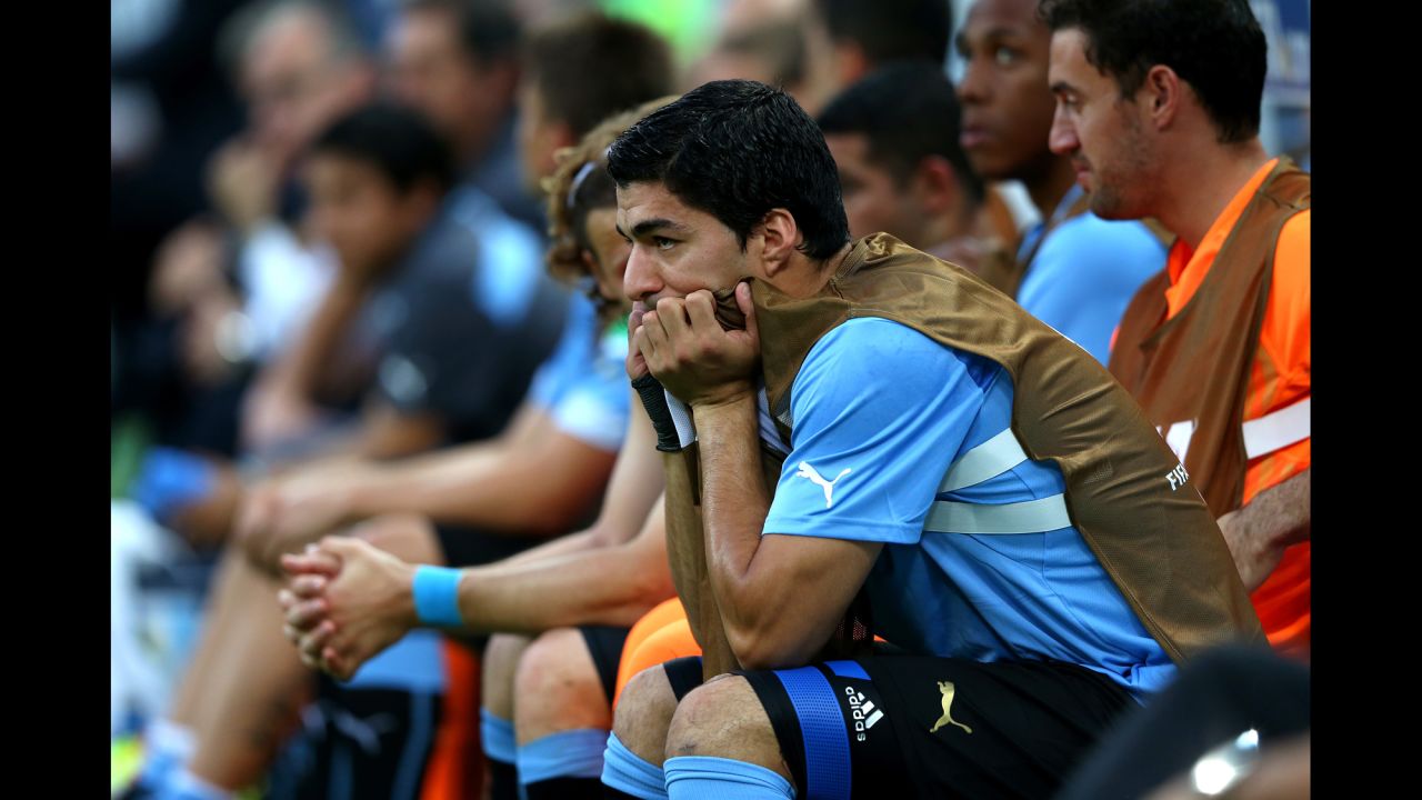  Luis Suarez, Uruguay's star player, watches from the bench. He is still recovering from a pre-tournament injury.