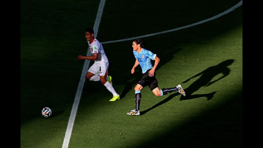  Edinson Cavani of Uruguay controls the ball against Michael Umana of Costa Rica.