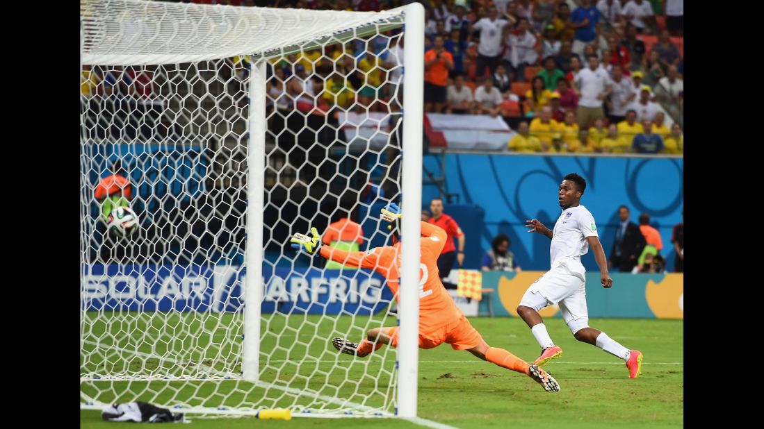 Striker Daniel Sturridge equalizes for England against Italy, beating goalkeeper Salvatore Sirigu.