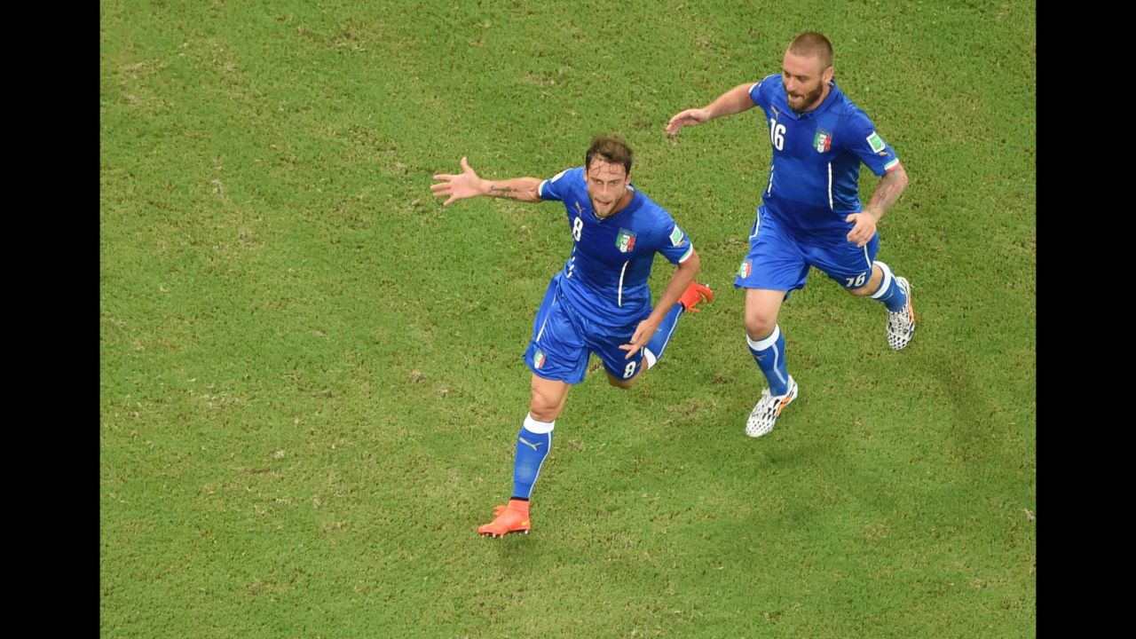 Italy midfielder Claudio Marchisio, left, celebrates with teammate Daniele De Rossi after scoring the opening goal.