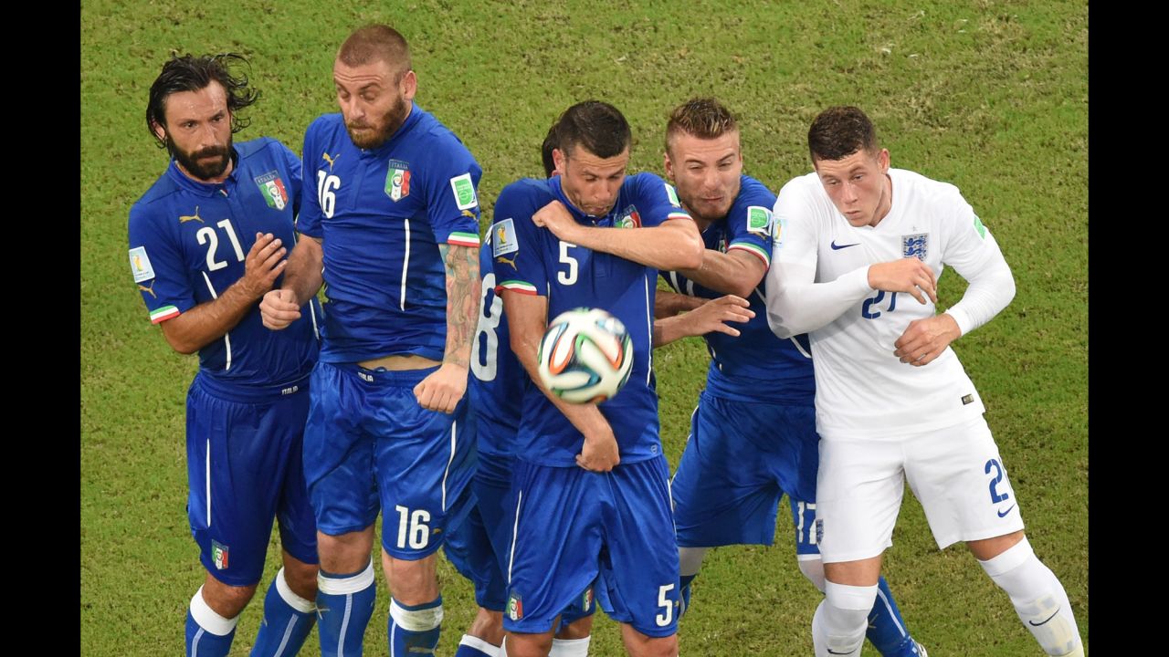 Italian players jump during a free kick during a World Cup match against England at the Amazonia Arena in Manaus, Brazil, on June 14. Italy defeated England 2-1.
