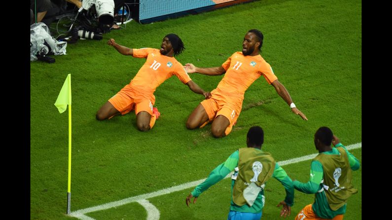 Gervinho of the Ivory Coast, left, celebrates scoring his team's second goal with teammate Didier Drogba during the World Cup match between the Ivory Coast and Japan at Arena Pernambuco on June 14 in Recife, Brazil. Ivory Coast defeated Japan 2-1. It was the third day of the tournament, which is being held in 12 cities across Brazil. <a href="index.php?page=&url=http%3A%2F%2Fwww.cnn.com%2F2014%2F06%2F13%2Ffootball%2Fgallery%2Fworld-cup-0613%2Findex.html" target="_blank">See Saturday's best photos</a>