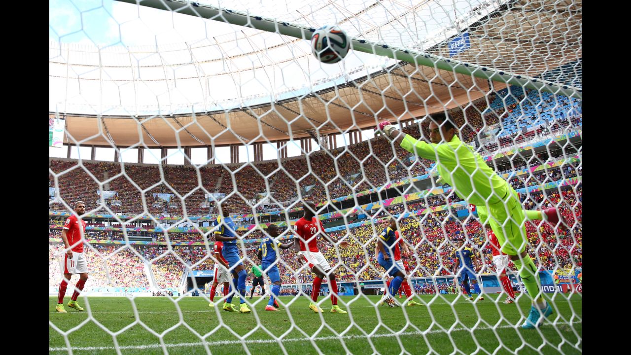 Enner Valencia, second left, scores for Ecuador against Switzerland, heading a corner past keeper Diego Benaglio.