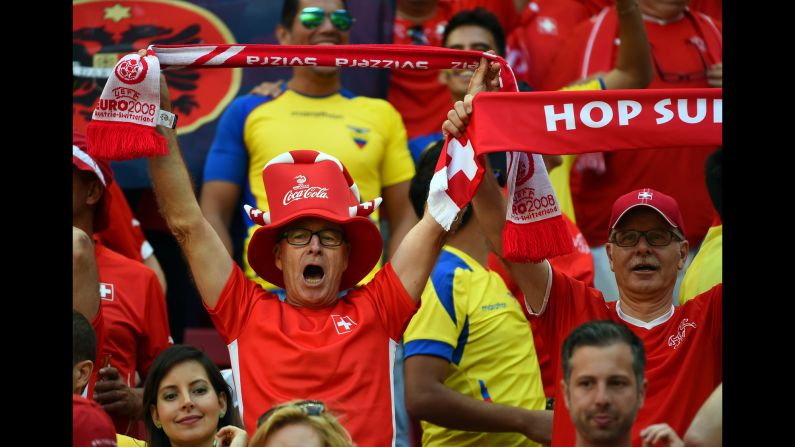 Swiss fans cheer and hold up banners during the game. <a >See the best World Cup photos from June 14.</a>