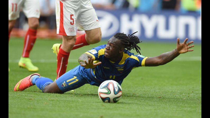 Ecuador forward Felipe Caicedo appeals for a free kick as he falls on the pitch.