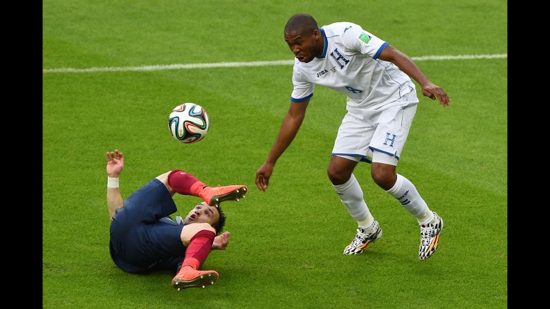 France midfielder Mathieu Valbuena hits the ground while battling for the ball with Honduras' Wilson Palacios. 