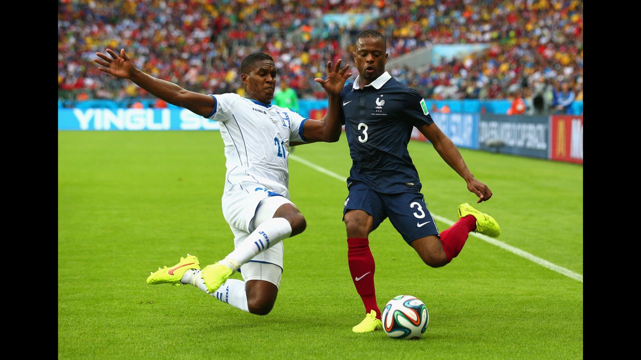 Brayan Beckeles of Honduras challenges Patrice Evra of France.