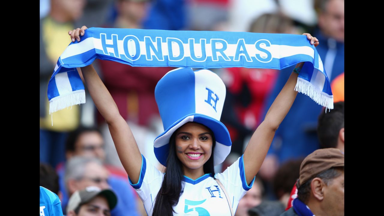  A Honduras fan holds up a banner as she cheers on her team. 