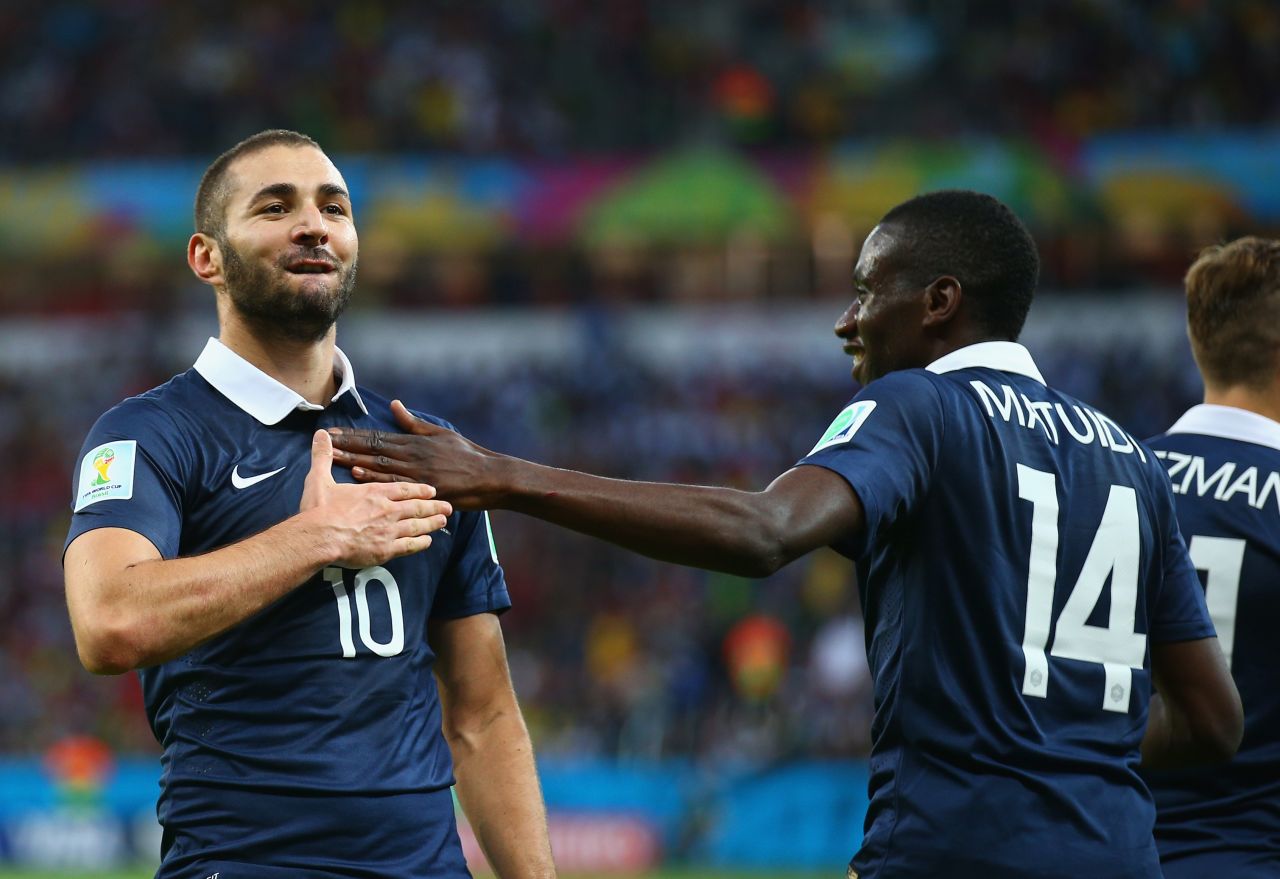 Karim Benzema, left, celebrates with teammate Blaise Matuidi after scoring France's third goal against Honduras on June 15. It was his second goal of the match, which France won 3-0 in Porto Alegre, Brazil.