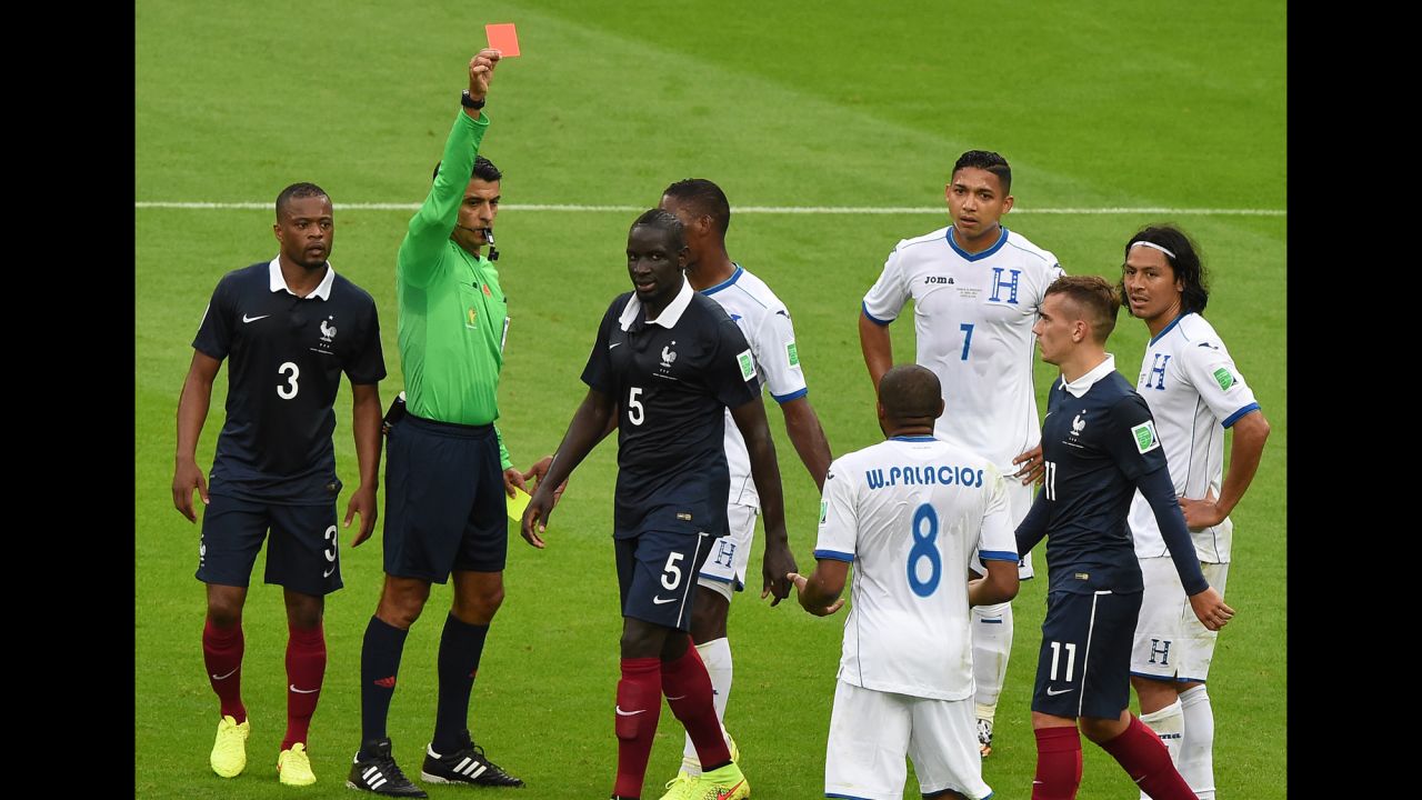 Honduras midfielder Wilson Palacios, center, receives a red card from Brazilian referee Sandro Meira Ricci.
