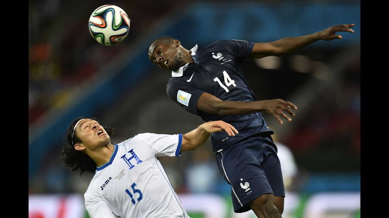 Honduras midfielder Roger Espinoza, left, and France midfielder Blaise Matuidi vie for the ball.