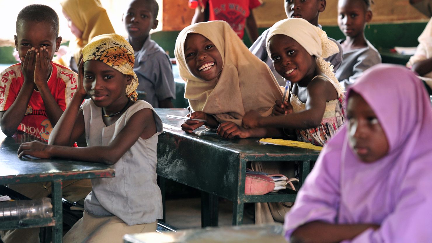 Children pose in a classroom at the Friendship Primary school in Zinder, Niger, on June 1, 2012. 
