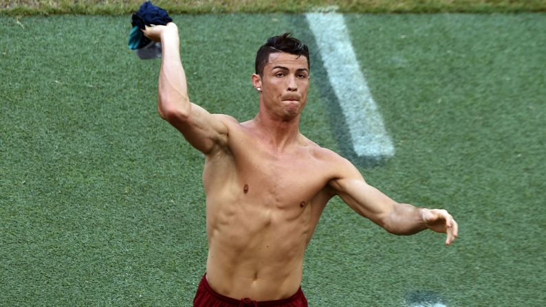Ronaldo throws his shirt to fans prior to the start of the match.