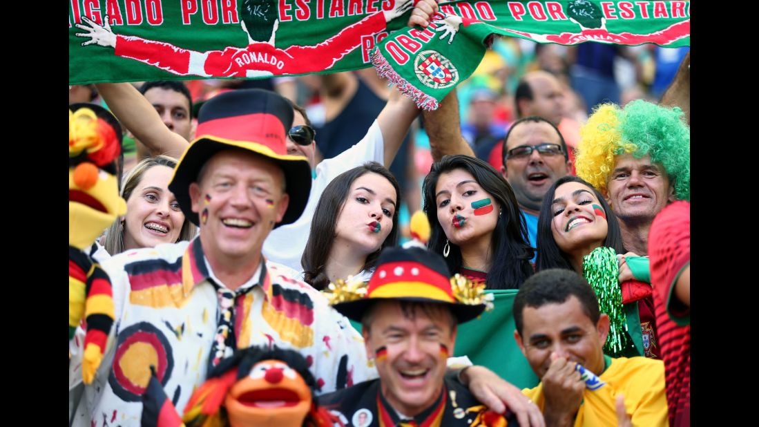 Germany and Portugal fans are seen together in the stadium before the game.
