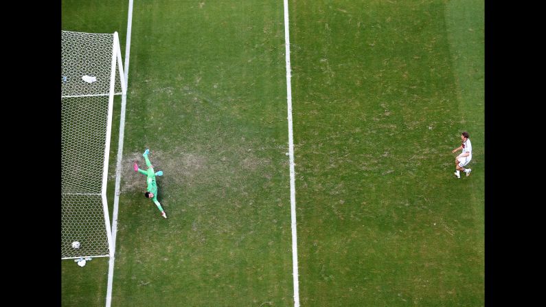 Mueller opens the scoring on a penalty kick, slotting the ball past Rui Patricio of Portugal. The penalty was awarded after Mario Goetze was brought down in the box.