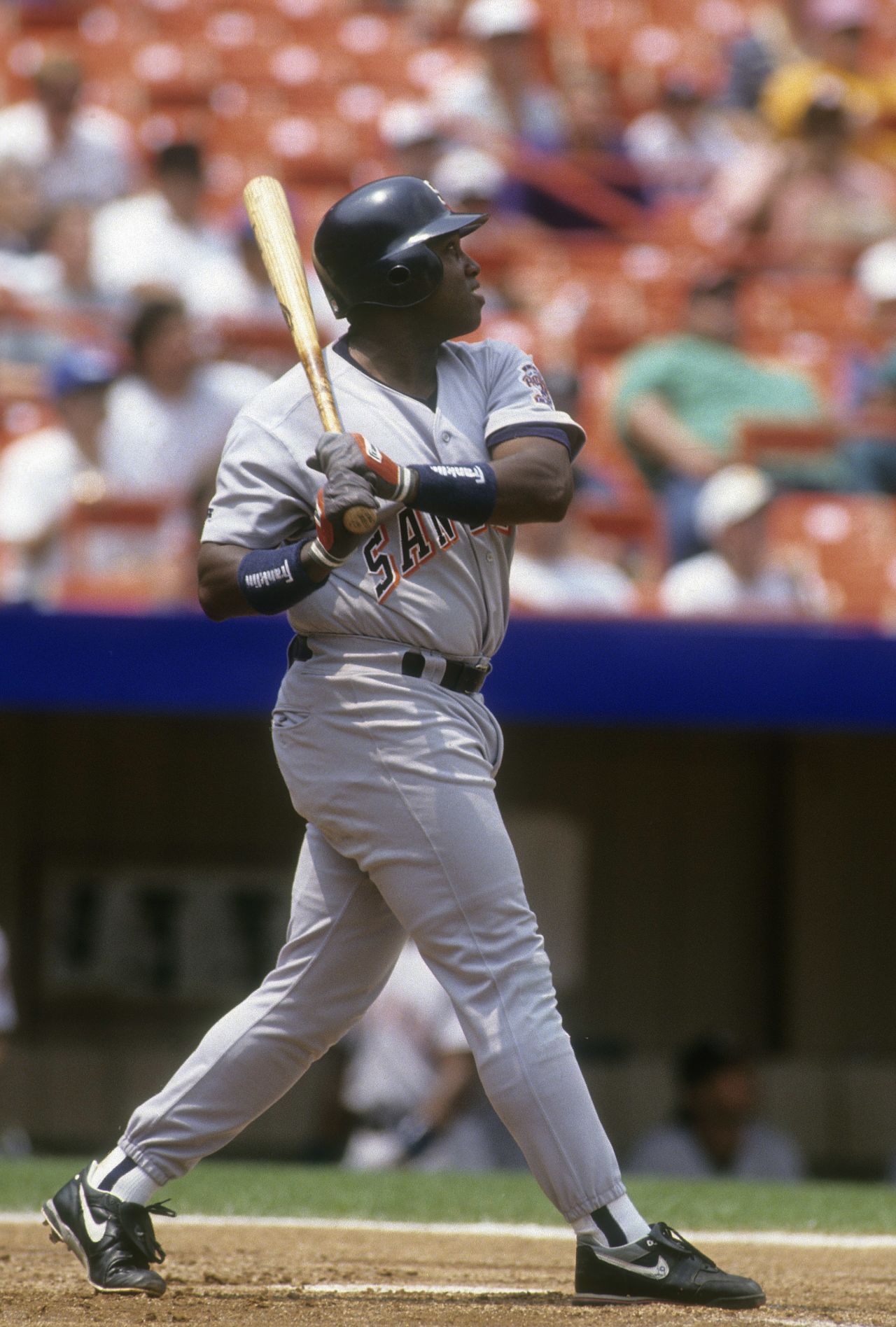 Gwynn watches the flight of a ball against the New York Mets in 1993. Gwynn finished his career with 3,141 career hits and a .338 batting average.