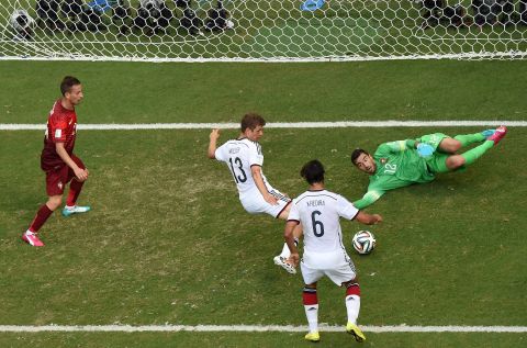 Germany's Thomas Mueller scores his third goal of the game -- and the fourth for his team -- en route to a 4-0 pasting of Portugal on June 16.