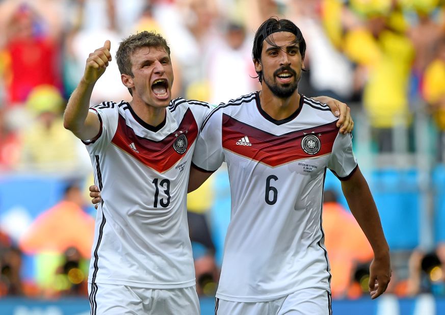 Germany's Thomas Mueller, left, celebrates with Sami Khedira after scoring his team's fourth goal. Mueller scored three of Germany's goals.