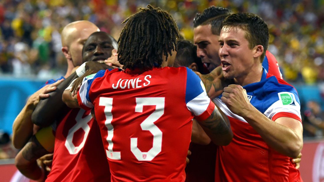 Jones and other American players celebrate together after Dempsey scored the first goal of the game.