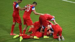 NATAL, BRAZIL - JUNE 16: John Brooks of the United States celebrates scoring his team's second goal with teammates during the 2014 FIFA World Cup Brazil Group G match between Ghana and the United States at Estadio das Dunas on June 16, 2014 in Natal, Brazil. (Photo by Laurence Griffiths/Getty Images)