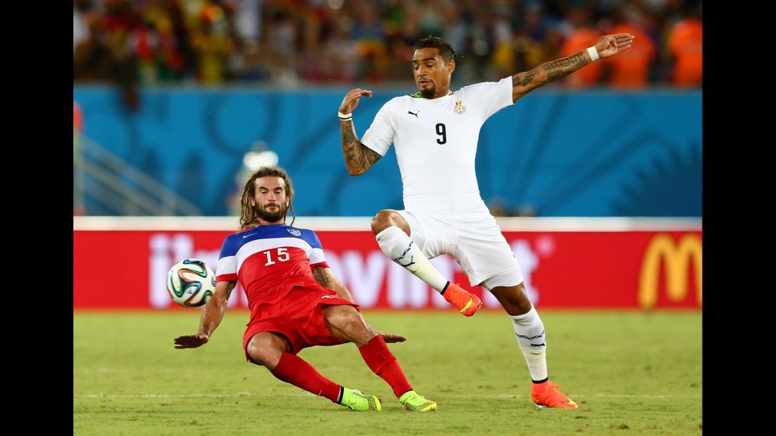 Kyle Beckerman of the United States tackles Kevin-Prince Boateng of Ghana.