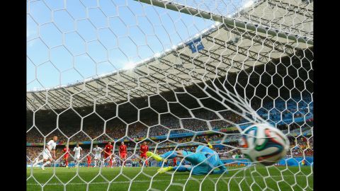 A behind-the-goal angle of Feghouli's first-half score. The penalty kick was awarded after Feghouli was fouled in the box by Belgian left back Jan Vertonghen.