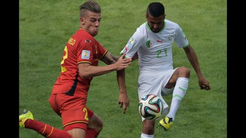 Belgian defender Toby Alderweireld, left, vies for the ball against Algeria's Riyad Mahrez.