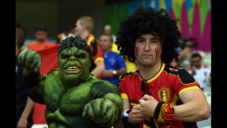 A Belgium fan and a man dressed as the Incredible Hulk pose for a photo before the match. <a href="index.php?page=&url=http%3A%2F%2Fwww.cnn.com%2F2014%2F06%2F16%2Ffootball%2Fgallery%2Fworld-cup-0616%2Findex.html">See the best World Cup photos from June 16. </a>