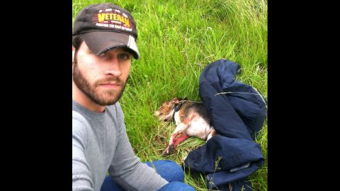 Aaron Schneider, an Iraq War veteran, snapped this shot after he rescued a beagle that he saw get hit by a car on Interstate 470 in Lee's Summit, Missouri. Schneider crossed several lanes of traffic to get the dog to safety, and he later took it to get medical care, <a href="http://www.kmbc.com/news/iraq-war-veteran-saves-dog-hit-by-car-along-i470/26484176#!0c192" target="_blank" target="_blank">according to KMBC.</a> The dog was expected to recover from its injuries. 