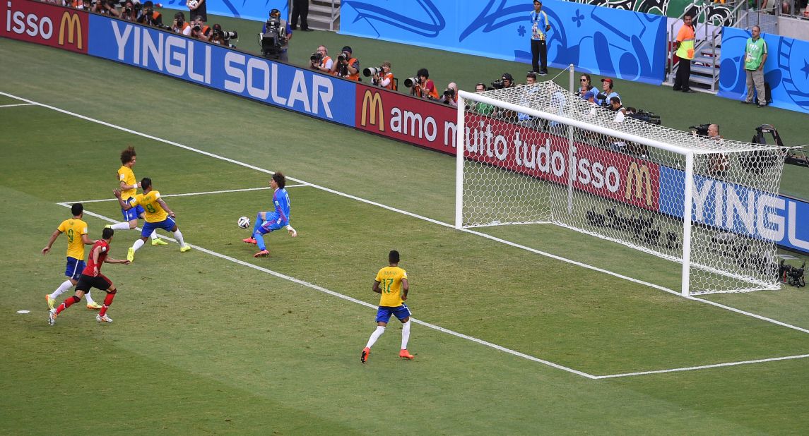Ochoa makes another save. Both Brazil and Mexico now have a win and a draw through two games played at this World Cup.