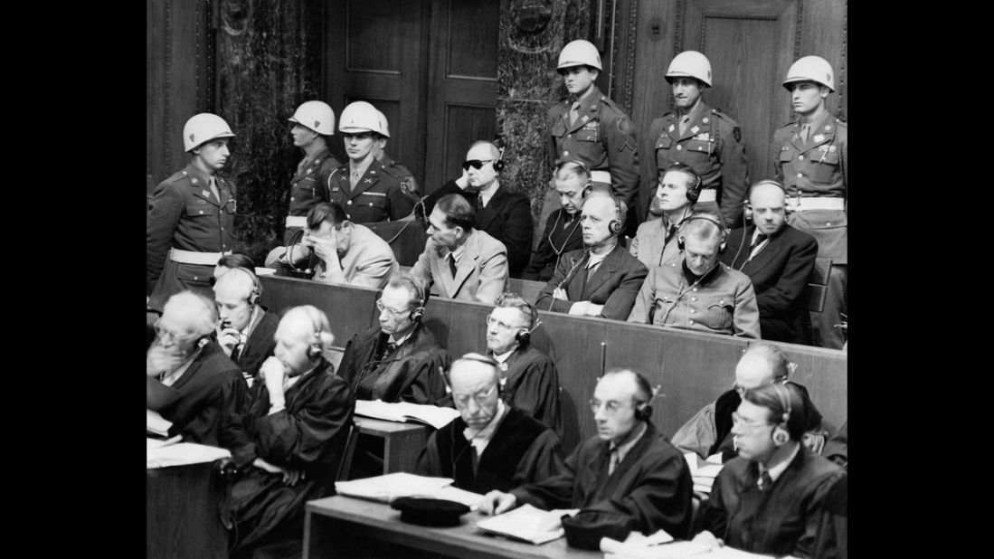 Versailles' collective punishment of a humiliated Germany is widely believed to have led to World War II, prompting a reorientation in international law: Guilty nations have been replaced by war criminals, prosecuted and punished by international tribunals.  Here, German war crimes defendants sit in the Nuremberg  courtroom of the International Tribunal after WWII. Hermann Goering, Rudolph Hess, Joachim Von Ribbentrop, Wilhelm Keitel (front row), and Karl Doenitz, Erich Raeder, Baldor von Schirach, Fritz Sauchel (second row). 
