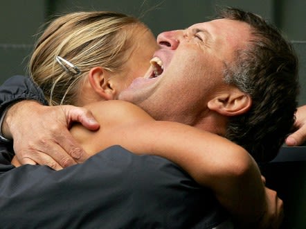 A tender moment as Sharapova embraces her father after Wimbledon win. - (Getty Images)
