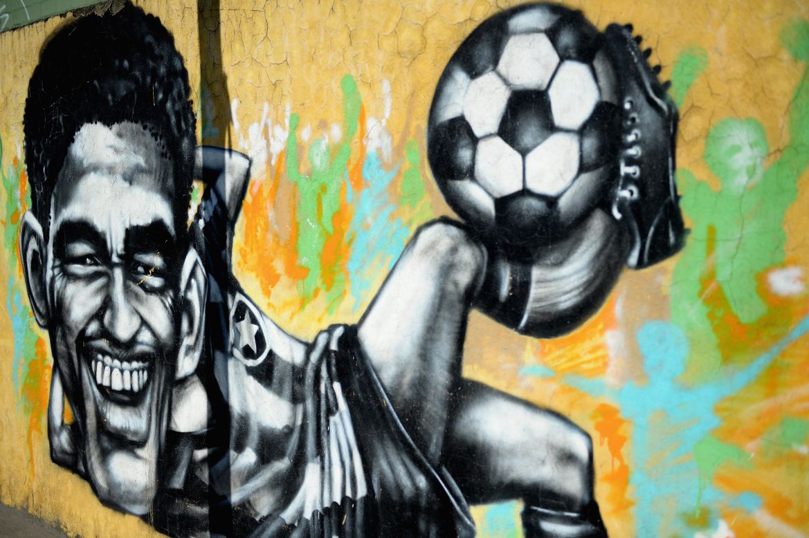Ito agrees wholeheartedly with this sentiment. <br /><br />"I think people at the same time don't agree 100% with the cup (but they) also like to watch some games," he said.<br />This Rio artwork pays tribute to former Brazilian World Cup winner Garrincha who was famed for his bendy legs and mesmerizing dribbling skills.