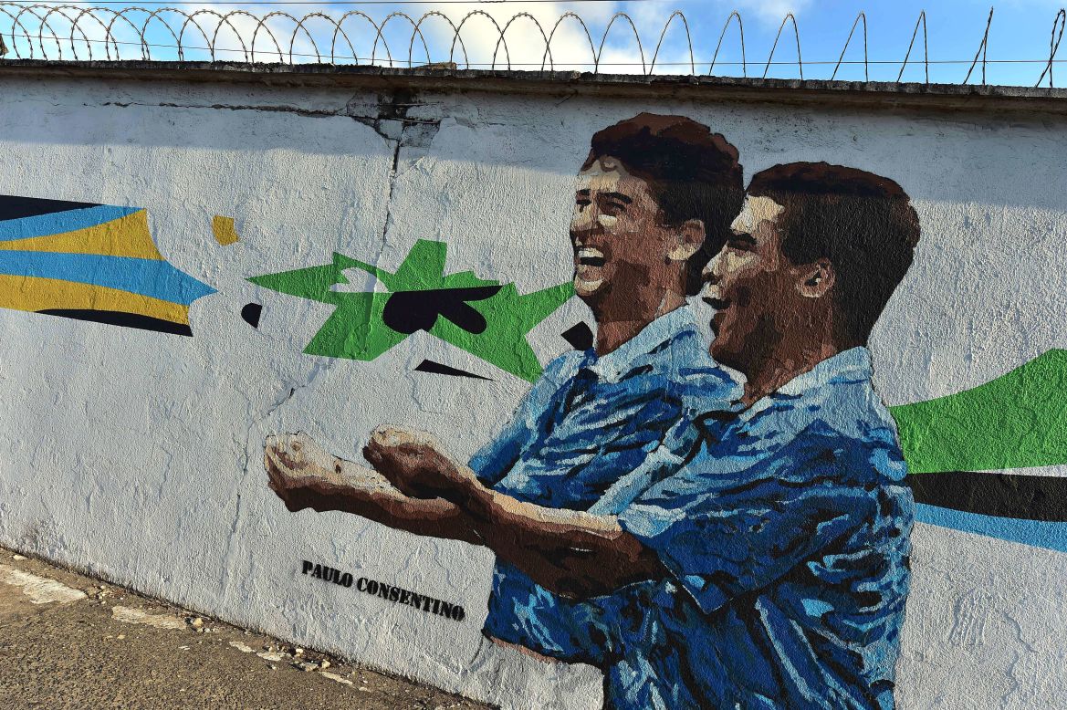 Both Ito and Cranio are quick to point out, however, that not all graffiti speaks critically of the World Cup.<br /><br />Brazilians have largely embraced the tournament, stadiums have been full and fans from all over the globe have been given a friendly welcome despite the controversy and protests. <br /><br />Here, Brazilian street artist Paulo Consentino depicts former Brazilian football stars Bebeto (L) and Romario (R) performing their famous "rock the baby" celebration at the 1994 World Cup.