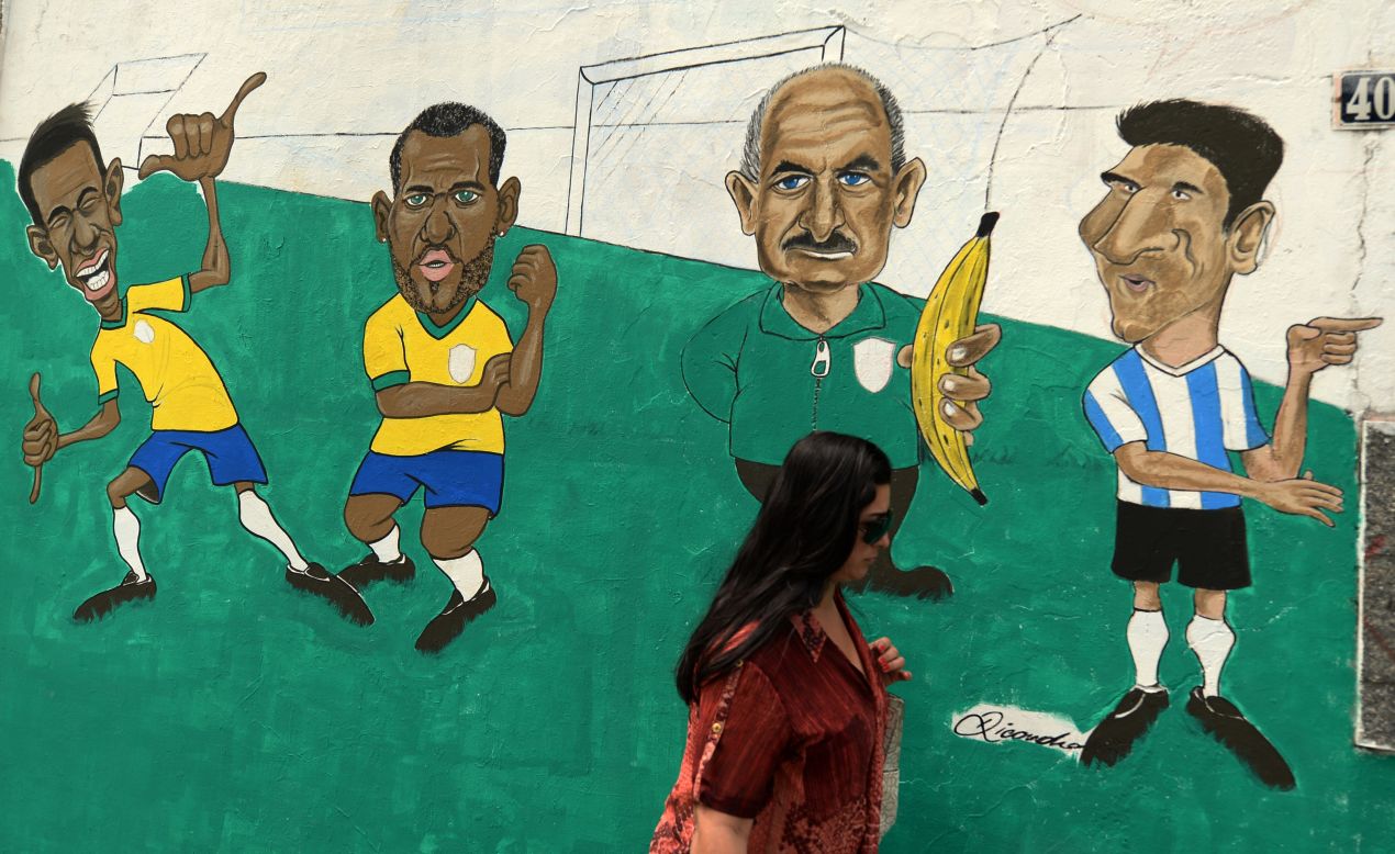 Brazil expects!<br /><br />Brazil's national team footballers (left to right) Neymar, Daniel Alves, coach Luiz Felipe Scolari and Argentina's Lionel Messi, are caricatured in a Rio de Janeiro suburb.<br /><br />The host nation could meet their great regional rival, Argentina, in the World Cup final on July 13th, a fixture that would be one of the biggest and most important ever staged in South America.