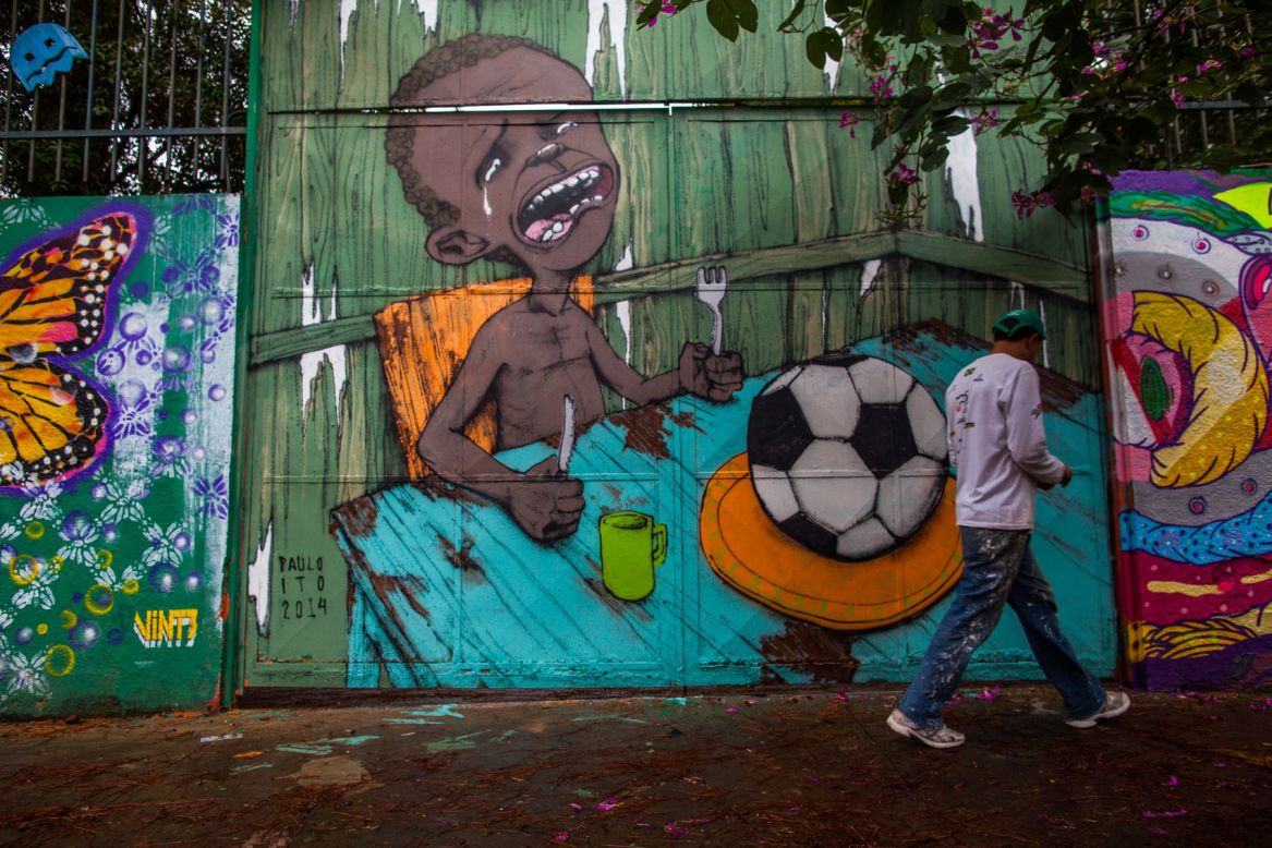 Ito, meanwhile, achieved international fame with this image of a starving child being presented with a football after it was carried by several major news organizations.<br /><br />"I was trying to talk about football at the moment of the FIFA Cup,"said Ito.<br /><br />"I never say (the World Cup) is a bad thing at all but there are problems, like relocating people to live in other neighborhoods and particularly I don't agree with the way FIFA operates."