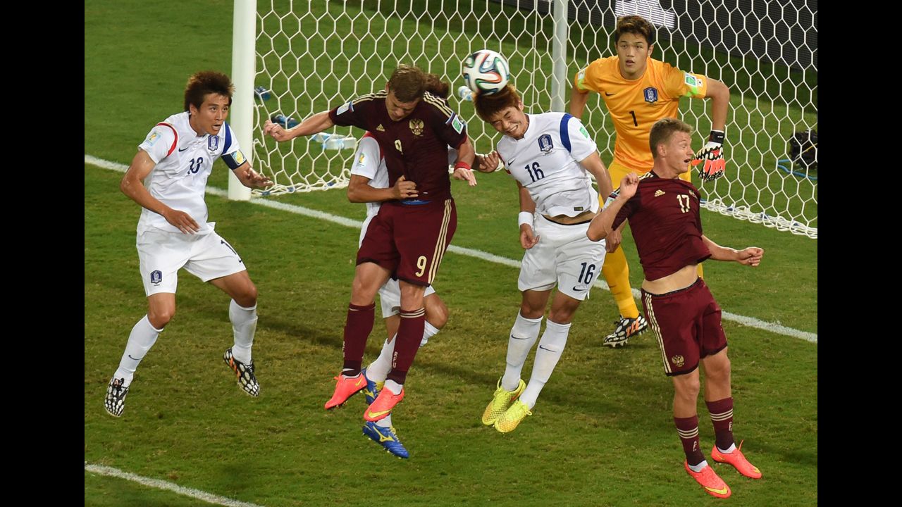 South Korean midfielder Ki Sung-Yueng, second from right, vies with Kokorin, second from left.