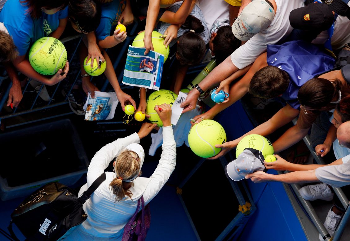 Fans scramble for an autograph from Sharapova at the 2008 Australian Open where she won in the final against Ana Ivanovic, having not dropped a set all tournament. 