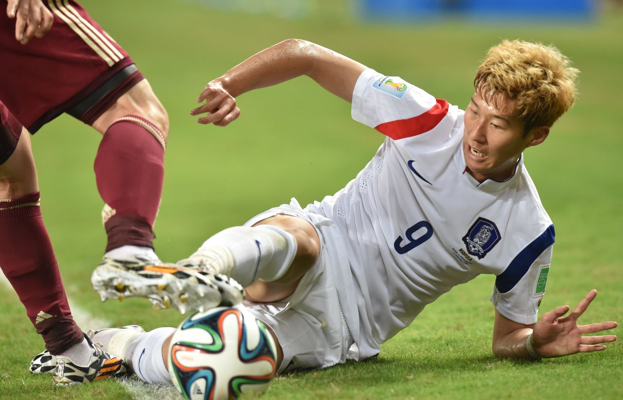 South Korean midfielder Son Heung-Min tries to get control of the ball.