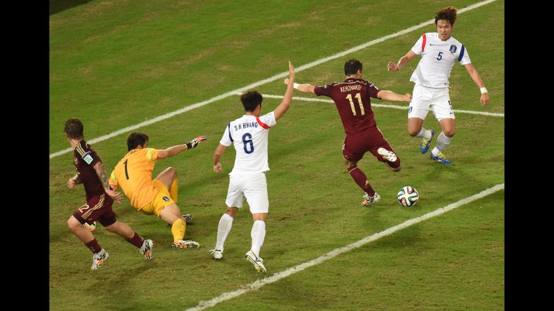 Russian forward Alexander Kerzhakov, second from right, scores the final goal of a 1-1 draw against South Korea on Tuesday, June 17, in Cuiaba, Brazil.